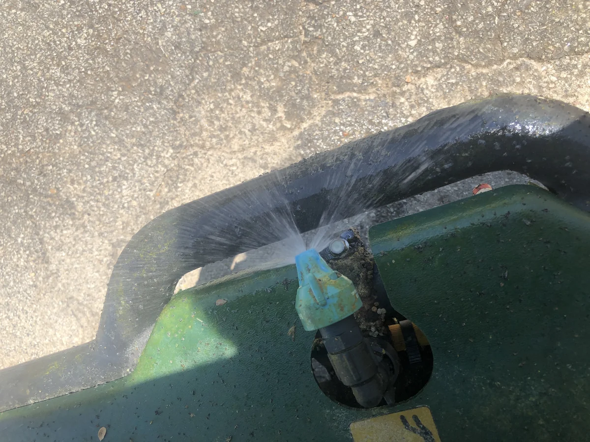 Worn Out Fan Spray Tip on Turfco T3100 Applicator with Clogged Nozzle — Mr. Lawn Care, Middle Tennessee lawn treatment